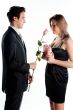 man gives a woman flowers
