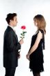 man gives a woman flowers