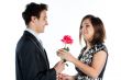 man gives a woman flowers