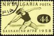 Javelin throwing on post stamp