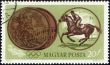 Sportsman riding horse and Olympic medal on post stamp