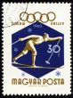 Running skier on post stamp