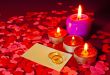 Two rings and a card with marriage proposal with four candles