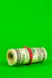 Roll of US dollars tied up with rubber