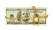 Stack of US 100 dollar bills chained and locked