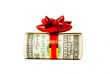 A wad of US one hundred dollar bills tied up with red ribbon