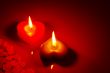 Two burning heart shaped candle