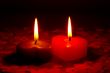 Two burning heart shaped candle