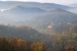 Foggy Hilly Terrain and Village