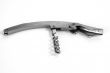 Corkscrew on white table