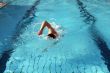 a man learn swim the crawl in water