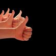 thumbs up on a black background