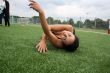 woman lying on the football field edge