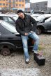 man screwed auto parts from old cars