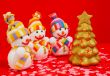 Three snowmen with golden evergreen tree