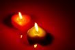 Two burning heart shaped candle