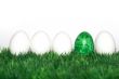A green egg between the white 