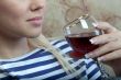 A girl with a glass of wine