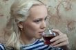 A girl with a glass of wine