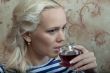 A girl with a glass of wine