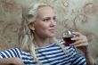 A girl with a glass of wine