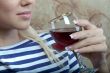A girl with a glass of wine