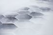 Hexagonal tiles covered with snow