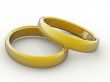 3D rendered image of a pair of golden wedding rings