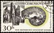 Mountains and fossil on post stamp