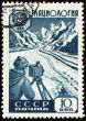 Researcher with device in mountain on post stamp