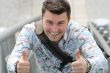 Young man with thumbs up