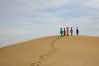 Walking women on sand