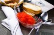 Red caviar in a glass plate 