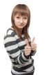 Young beautiful girl shows OK