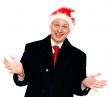 Man in suit and red tie in hat santa