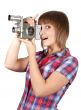 Girl in plaid shirt with movie camera