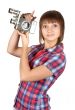 Girl in plaid shirt with movie camera