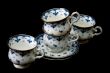 Four tea cups on saucer