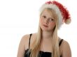 Beautiful blonde girl in a Santa hat