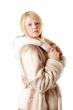 A beautiful young girl in a fur coat