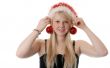 Beautiful blonde girl in a Santa hat