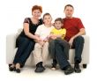 Family of four on a sofa
