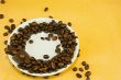 Saucer with coffee beans and chocolate bars