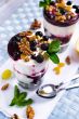 cream dessert with black currants