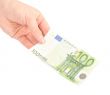 Money (Euro) in a hand isolated on white