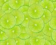 Green background with citrus-fruit of lime slices