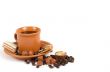 Cup of coffee with ingredients on a white background