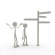 two figures stand in front of a direction sign