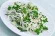 Salad of fresh cabbage and cucumber with herbs and sesame