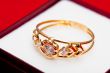 Gold ring with white zirconia enchased